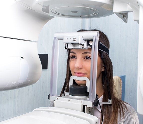 Dental patient receiving 3 D C T cone beam digital x-ray scan