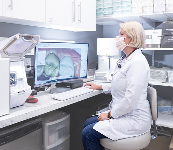 Doctor Obholz using advanced dental technology