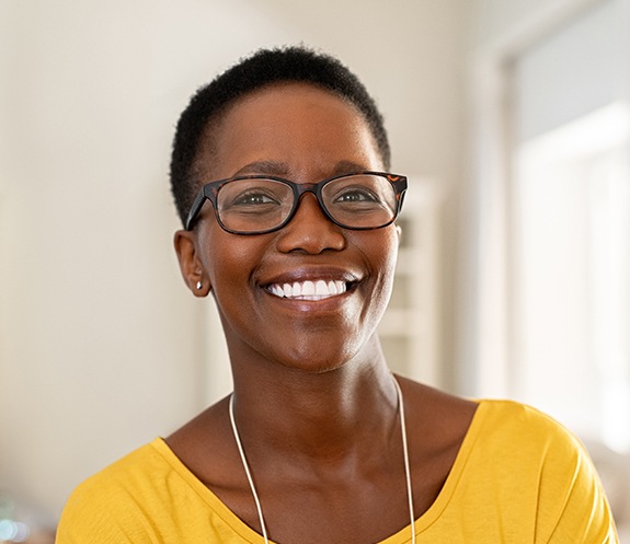 Woman sharing flawless smile after makeover