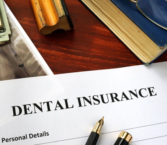 dental insurance form on table