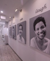 Hallway with pictures of dental patients displayed
