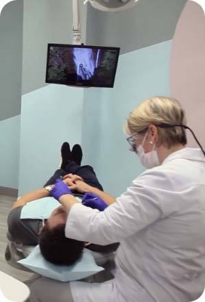 Dentist treating dental patient