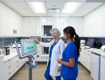 doctor and team member looking at patient results in North Bethesda