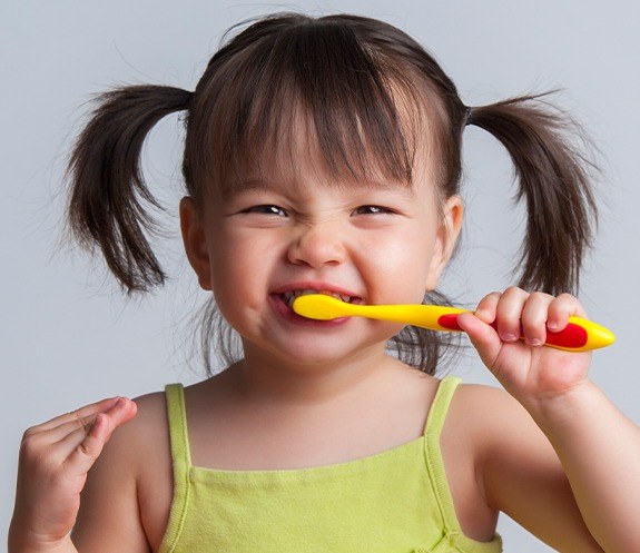 Child brushing teeth