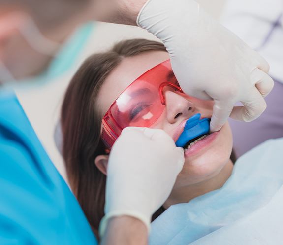 Dental patient receiving fluoride treatment