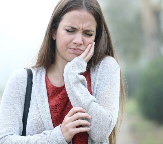 Woman in pain before emergency dentistry