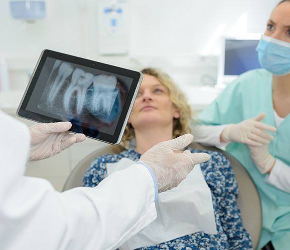 Dentist reviewing digital x-rays