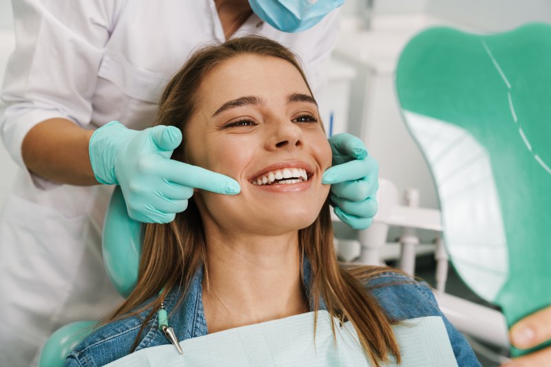 A woman with good oral health getting a whitening treatment
