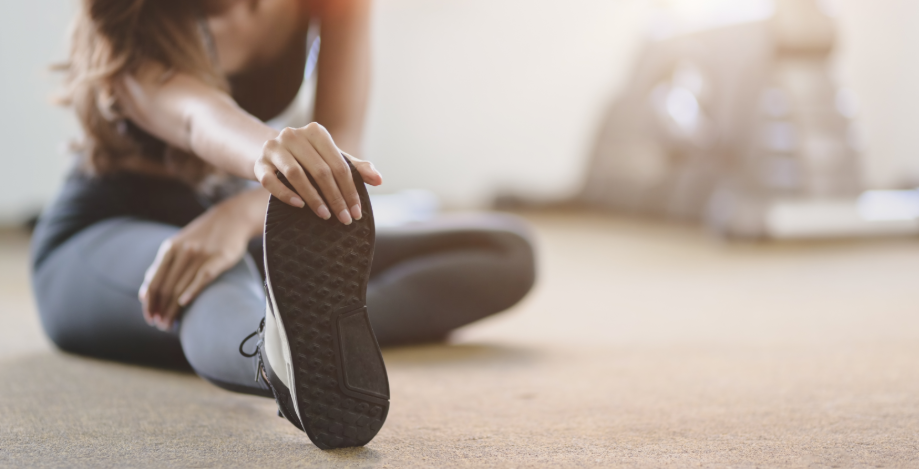 Woman stretching in workout gear